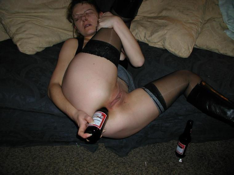 Woman having anal sex with bottle photo