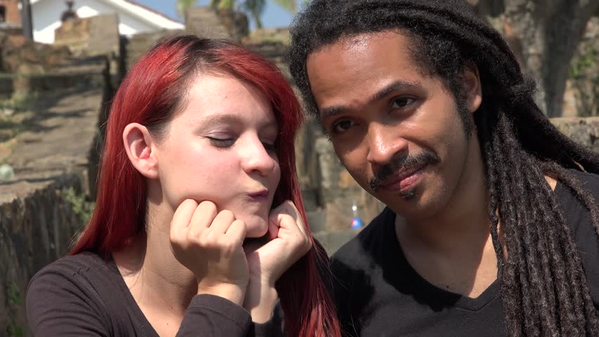 Black man and redhead girl