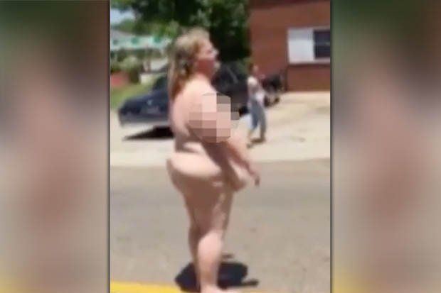 Naked woman standing street