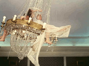 Swinging from chandelier